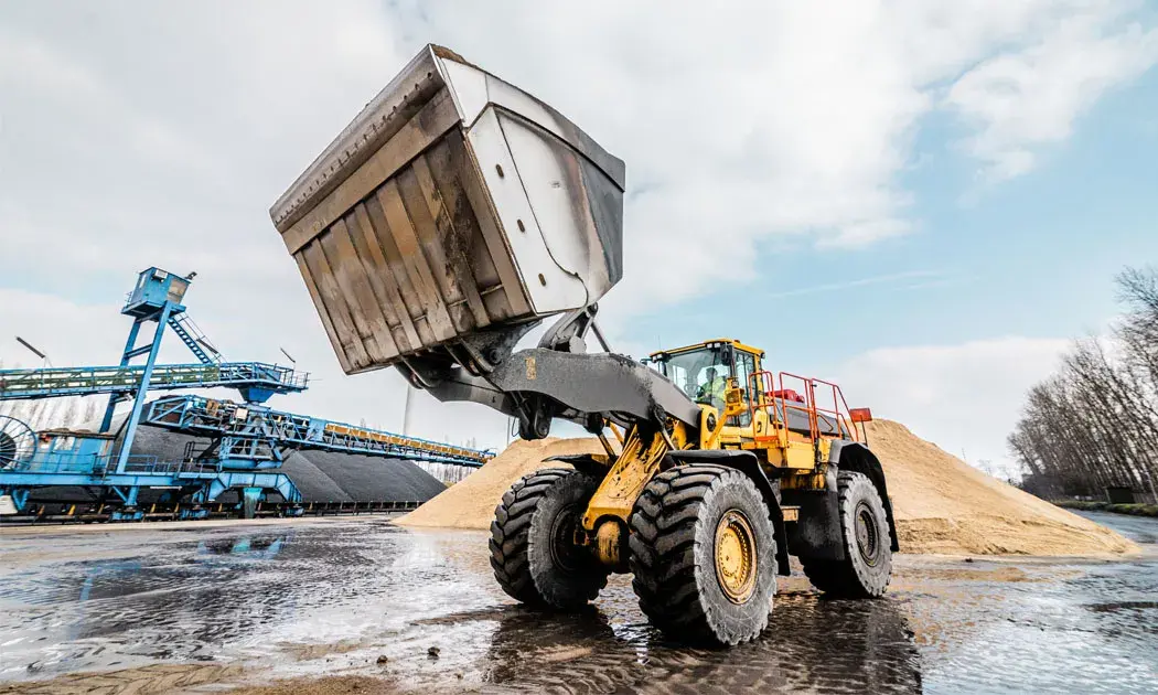 Dit is een wiellader met een gemonteerd onboard weegsysteem van RDS Weighing & Safety