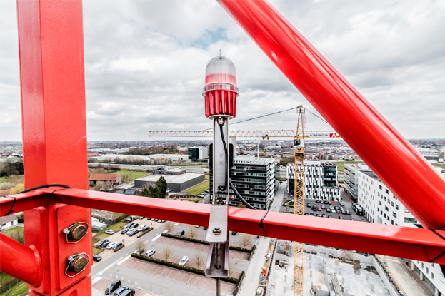 This is low intensity nighttime warning beacon mounted on a crane.