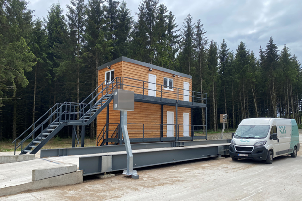 This is a floor-mounted weighbridge with automation